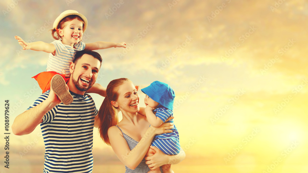 happy family of father, mother and two children, baby son and da happy family of father, mother and two children, baby son and da