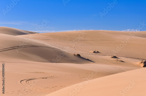 Landscape White sand dune with car tracks in Mui Ne  Vietnam Pop