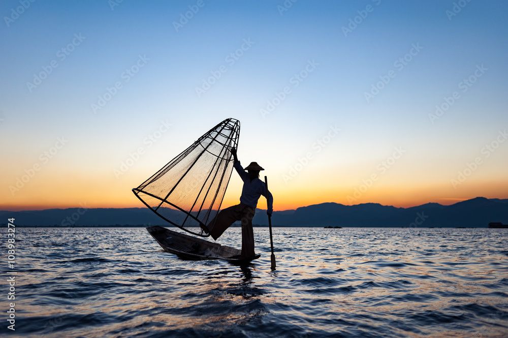 Local man fishing with a net at sunset, Amarapura, Mandalay region, Myanmar