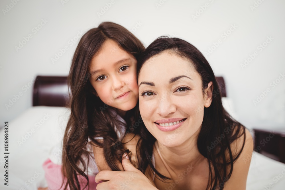 Portrait of happy mother and daughter at home Portrait of happy mother and daughter at home