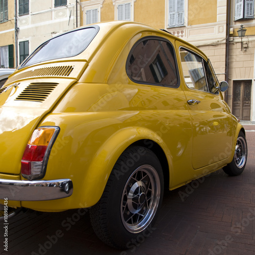 Classic car parked in a street. Back view