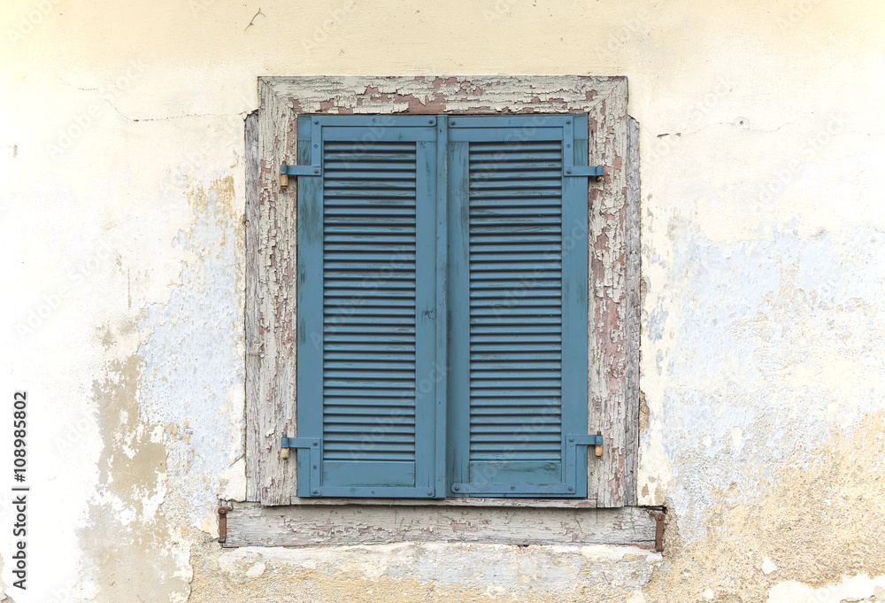 Blue old wooden window shutters