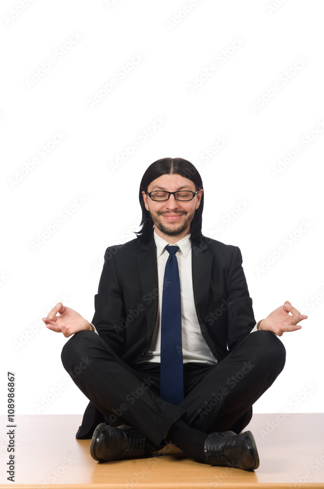 Young businessman sitting on the floor isolated on white Young businessman sitting on the floor isolated on white