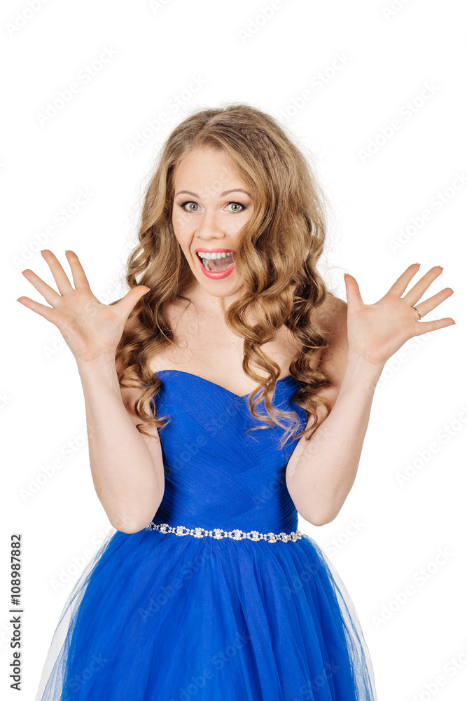 Studio shot young girl in elegant blue dress looking at the camera Studio shot young girl in elegant blue dress looking at the camera