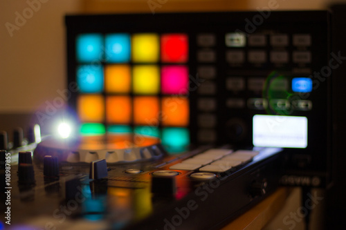 Wallpaper Mural DJ console cd mp4 deejay mixing desk Ibiza house music party in nightclub with colored disco lights. Torontodigital.ca