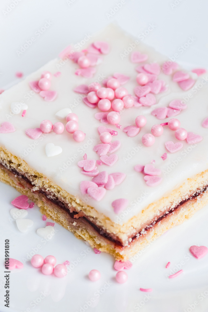 Glazed cake with pink ornaments Glazed cake with pink ornaments