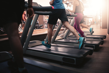 Fotobehang Fitness Hardlopen op loopband in sportschool  © Ivan Kurmyshov