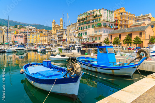 Fototapeta Naklejka Na Ścianę i Meble -  Traditional fishing boats in Bastia port on sunny summer day, Corsica island, France