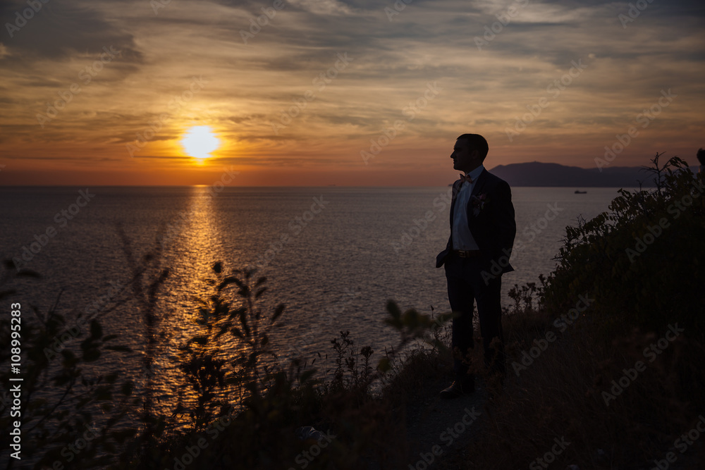 silhouette of a man on background of ocean