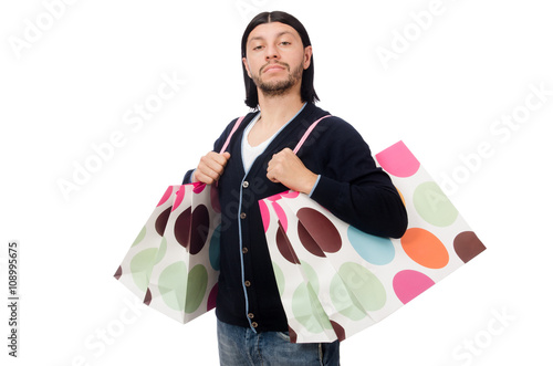 Young man holding plastic bags isolated on white