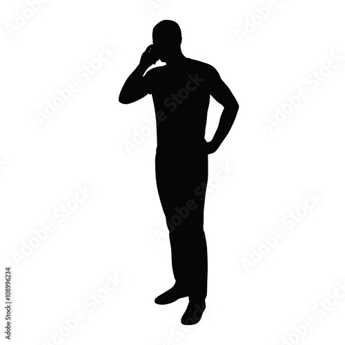Man on the phone while standing. Vector silhouette of a man