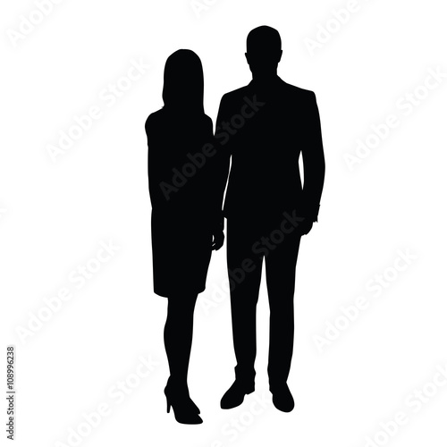 Man and woman in formal wear standing side by side. 