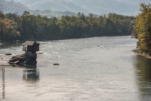 River Drina in Serbia with little house on rock photo