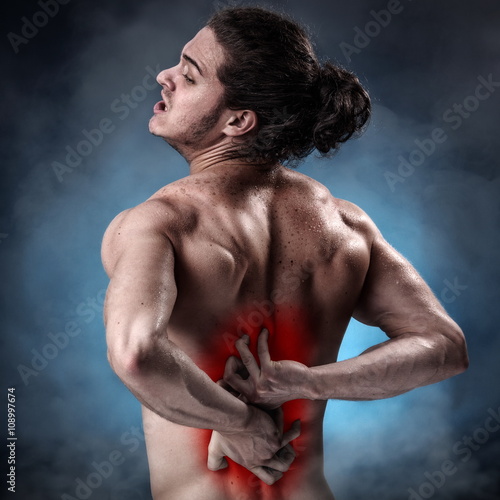 Obraz na plátne Young athlete with a painful twinge