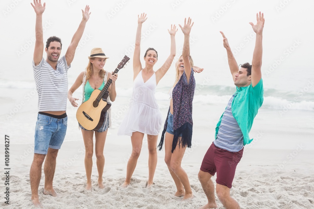 Obraz premium Group of friends playing guitar and dancing