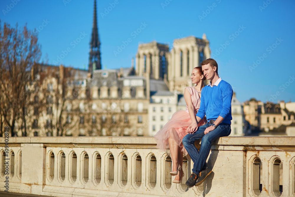 Young couple on the Seine embankment in Paris