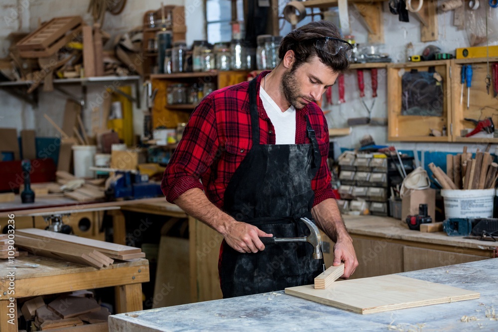 Carpenter working on his craft Carpenter working on his craft