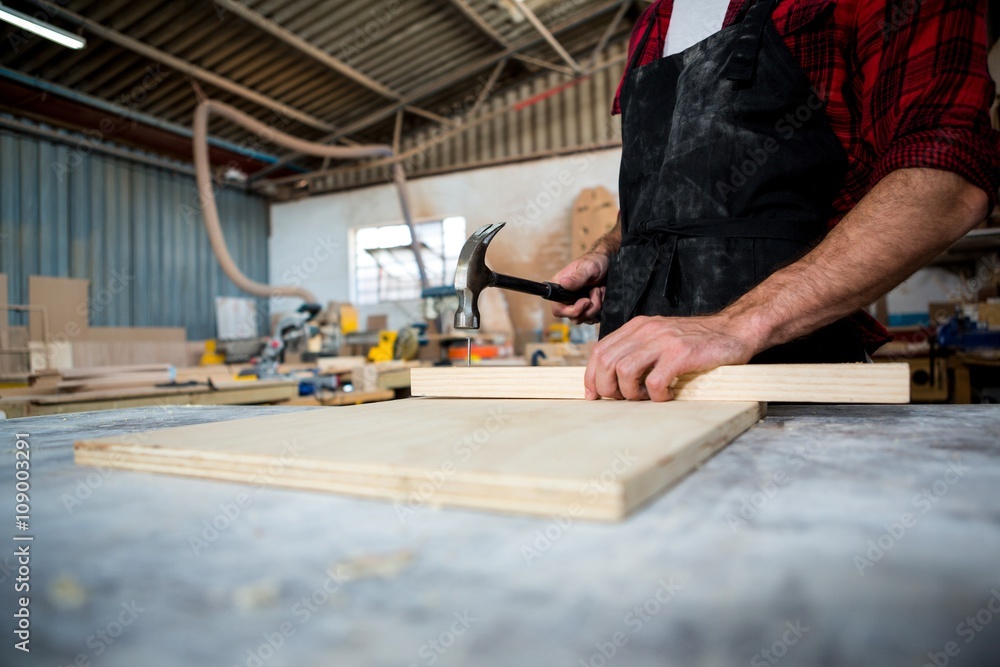 Carpenter working on his craft Carpenter working on his craft