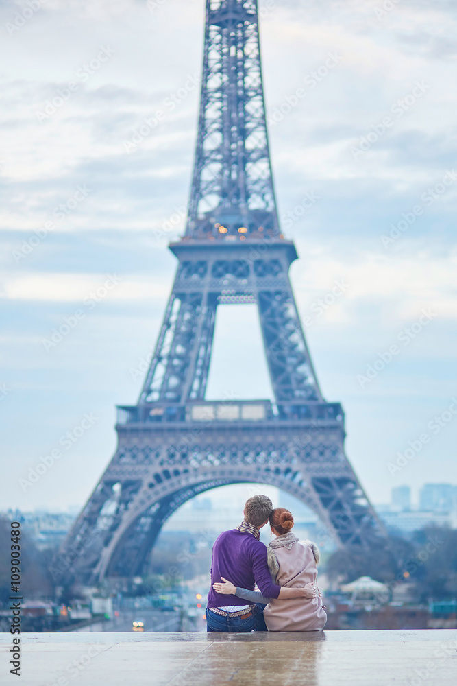 Couple near the Eiffel tower in Paris, France