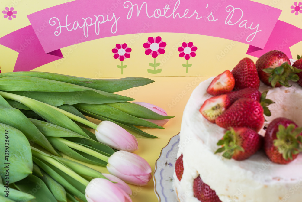 Homemade delicious strawberry cake and tulips for Mothers Day.