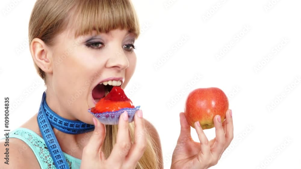 Woman choosing fruit or cake make dietary choice 4K Woman choosing fruit or cake make dietary choice 4K