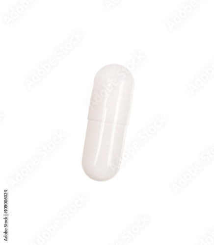 White medicine pill with drug isolated over white