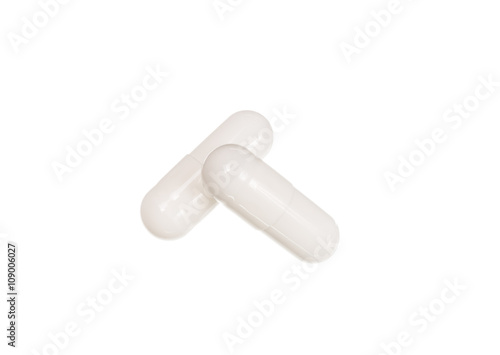 White medicine pills with drug isolated over white
