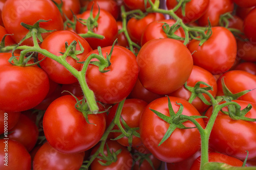 fresh tomatoes. red tomatoes background. Group of tomatoes © EwaStudio