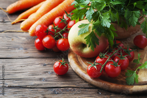 Concept of healthy food with carrot, tomato and apple
