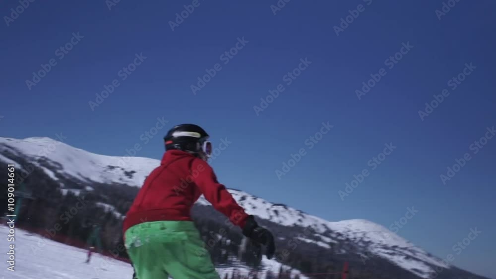 Snowboarder jumping from kicker and traning backflip to airbag Snowboarder jumping from kicker and traning backflip to airbag