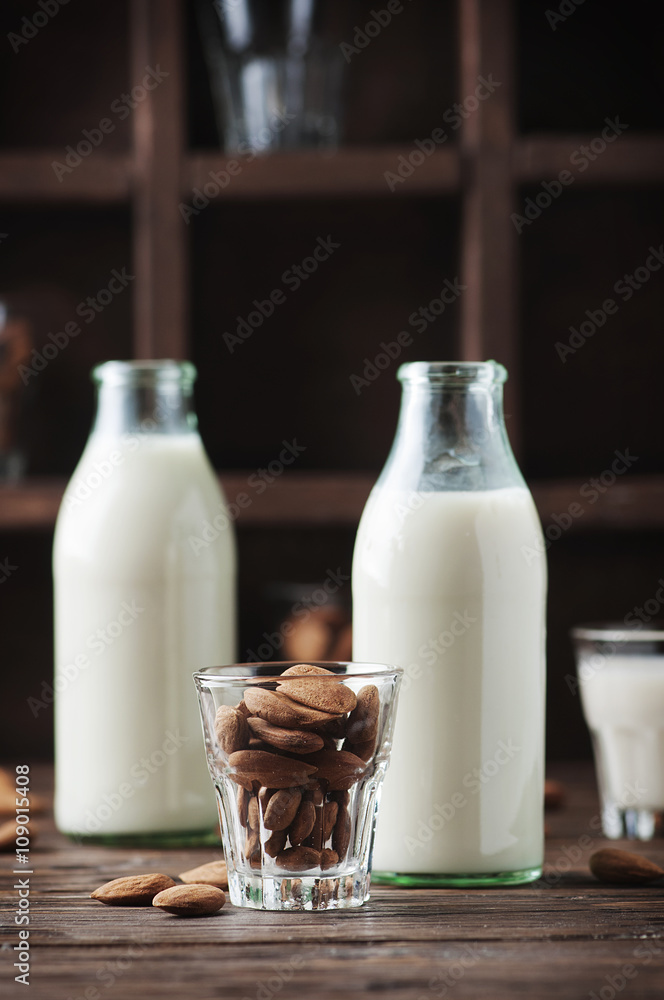 Vegan Almond milk on the wooden table Vegan Almond milk on the wooden table