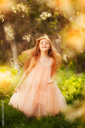 cute little girl in a spring garden