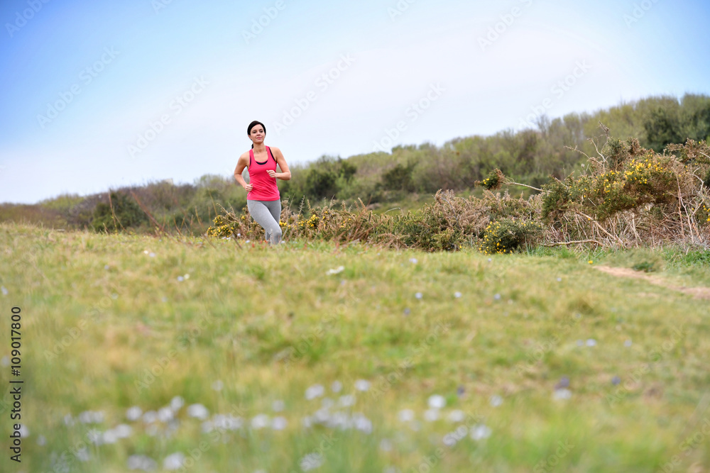 Woman running in the countryside