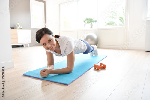 Woman doing workout exercises at home