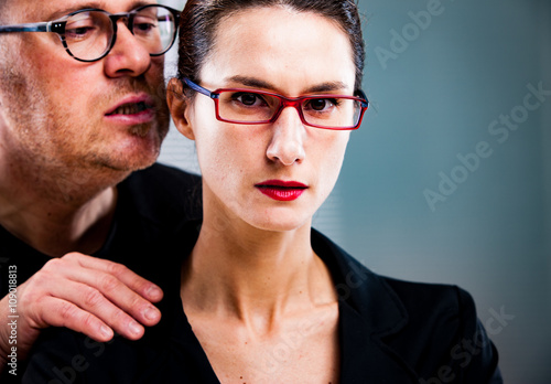 man threatens woman: harassments on the workplace