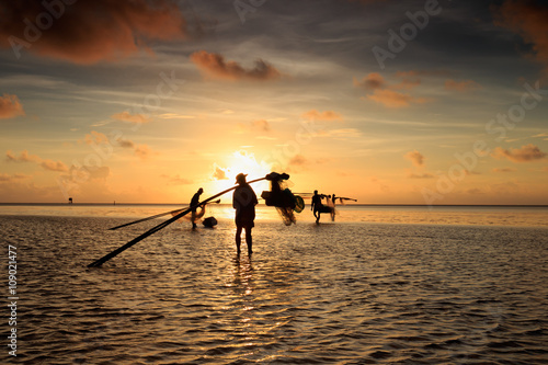 Fisher man in sunrise or sunset