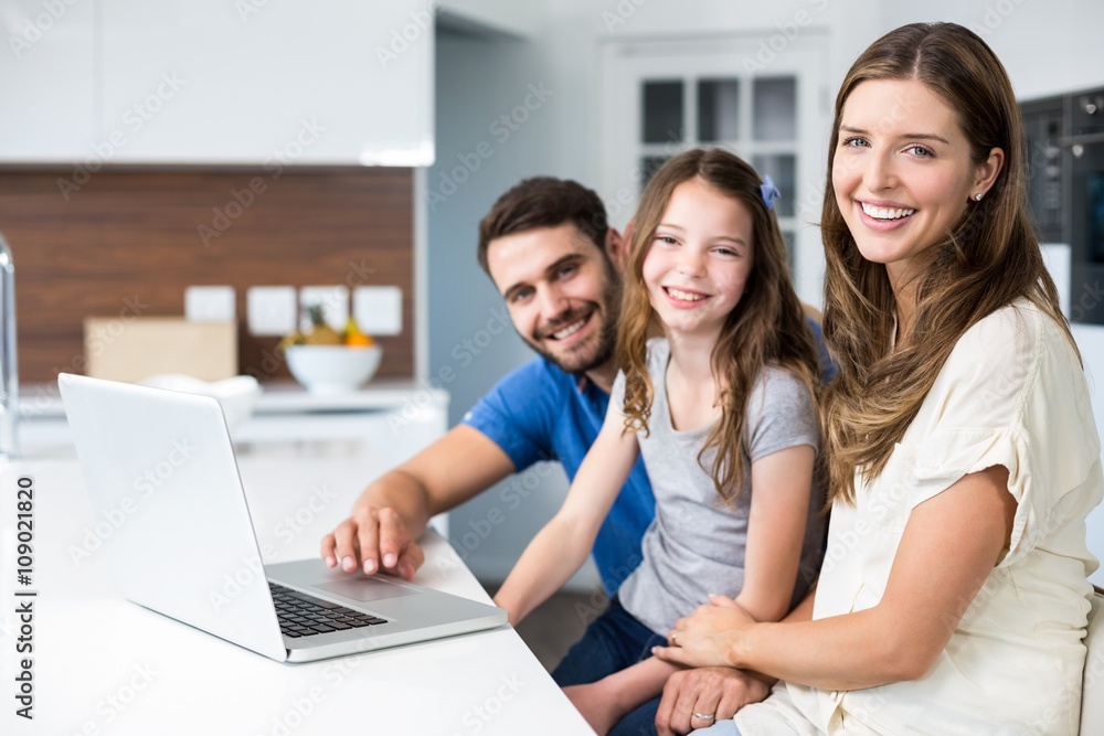 Portrait of family with laptop Portrait of family with laptop