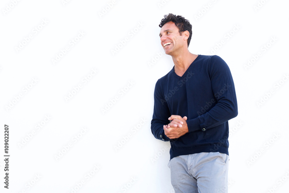 Middle aged man laughing against isolated white background Middle aged man laughing against isolated white background