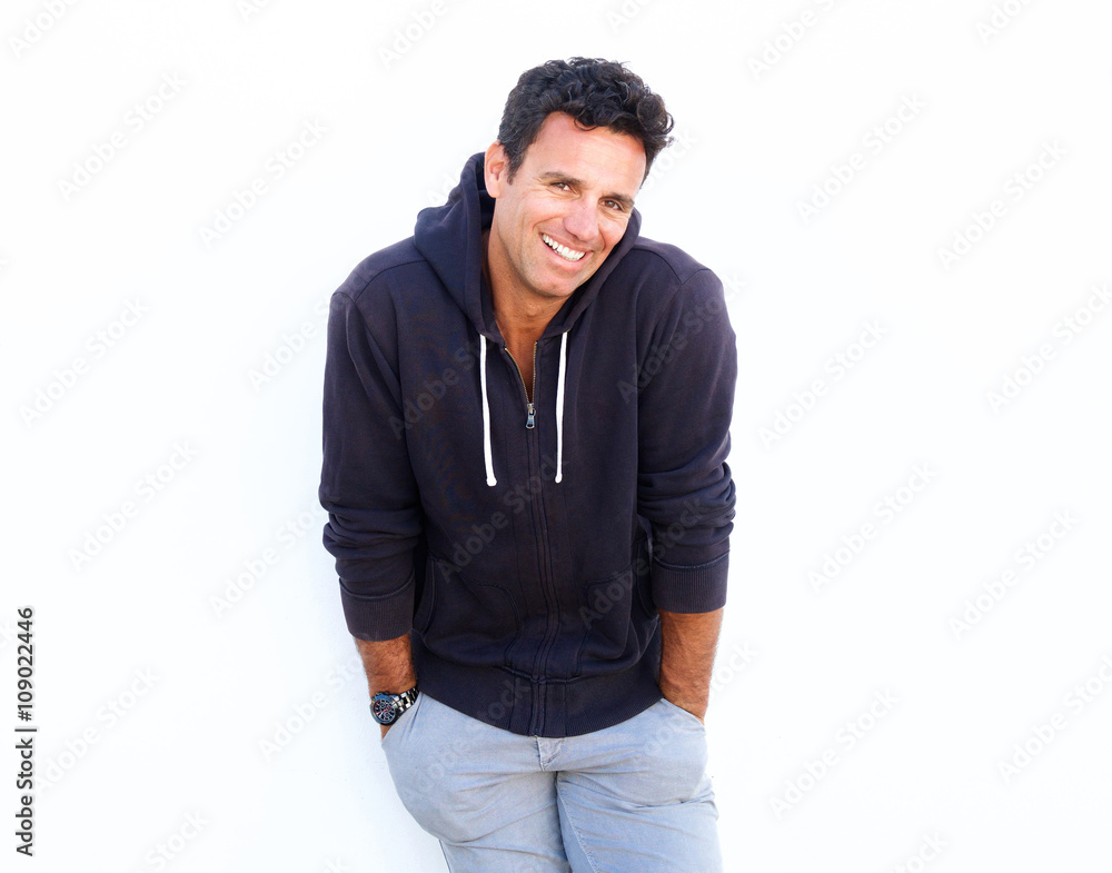Handsome middle aged guy laughing against white background Handsome middle aged guy laughing against white background