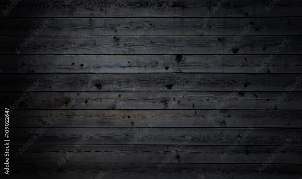 Fototapeta premium Schwarze Holzbretter als Hintergrund