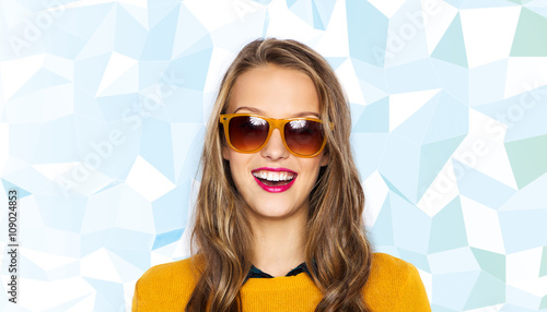 happy young woman or teen girl in sunglasses