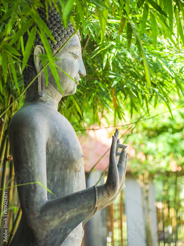 Standing Buddha status . Buddha image style pagoda.