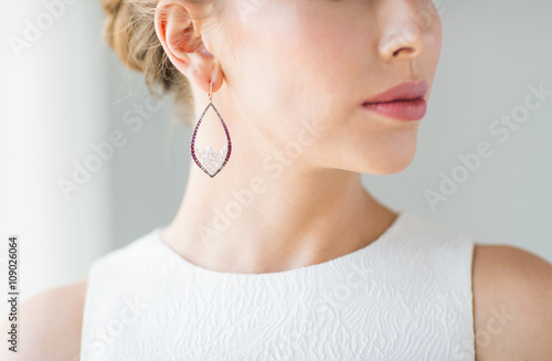 Obraz na plátne close up of beautiful woman face with earring