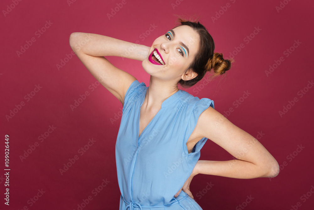 Cheerful playful young woman smiling and posing Cheerful playful young woman smiling and posing