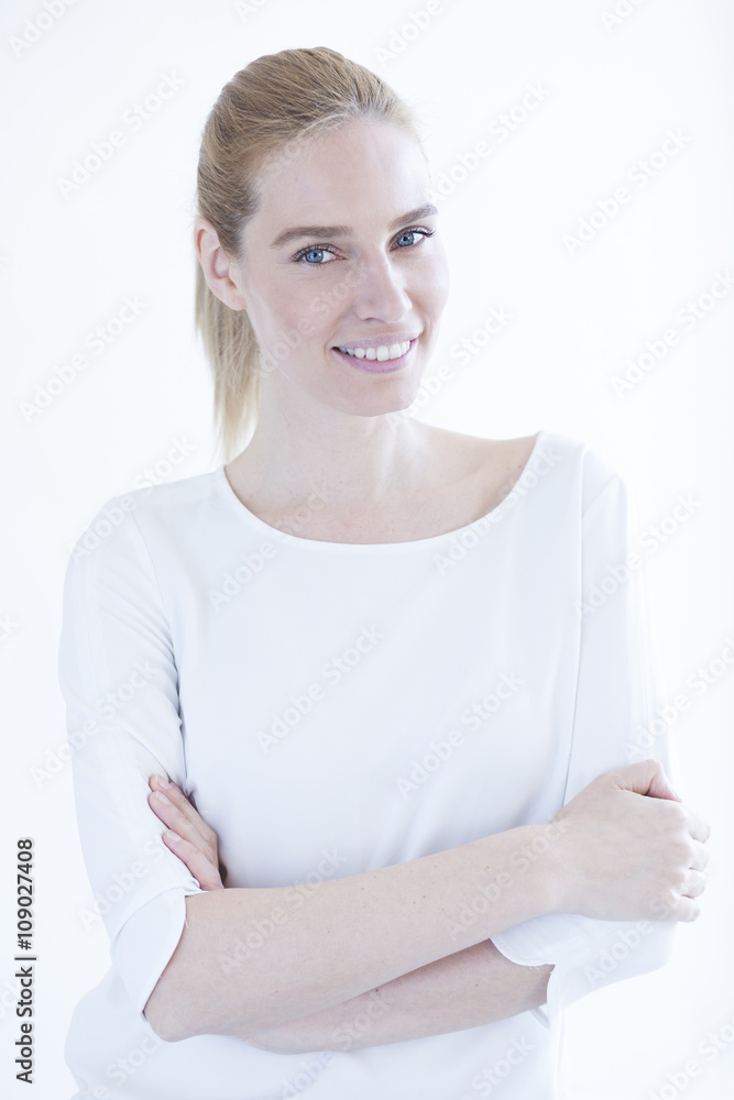 Portrait of beautiful blonde business woman isolated on white background,crosses arms Portrait of beautiful blonde business woman isolated on white background,crosses arms