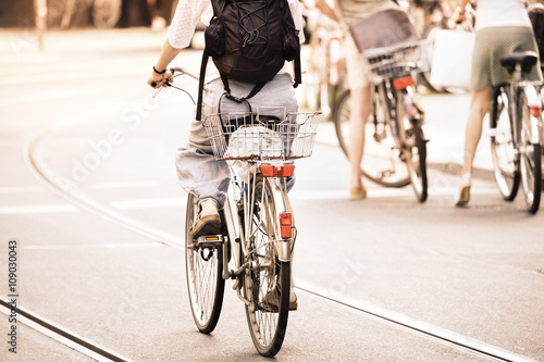 People on bikes in traffic