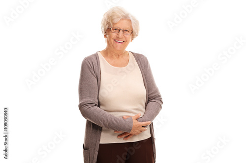Obraz na plátně Studio shot of a cheerful old lady smiling