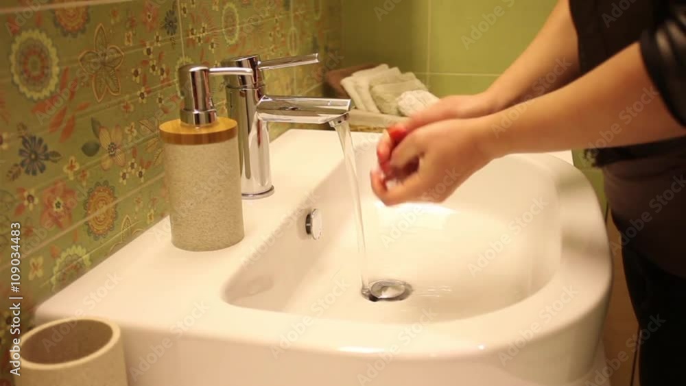 Washing hands under faucet, Woman wash hands Washing hands under faucet, Woman wash hands