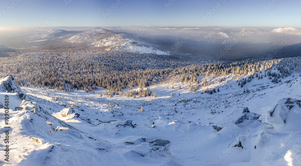 Winter Table Mountain range landscape near small village in Ural