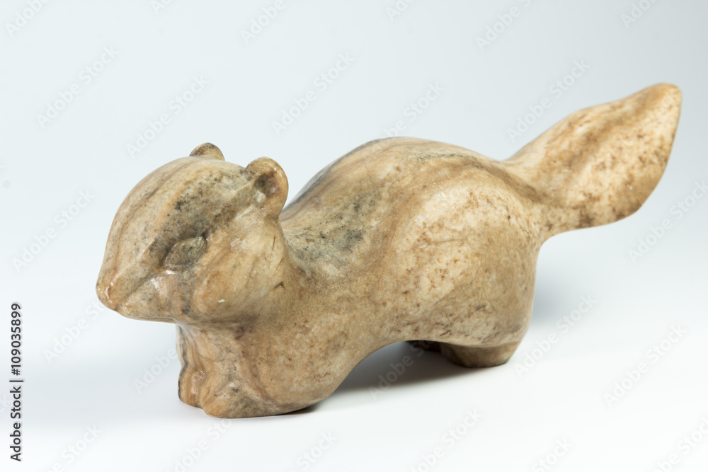 stone statue of a badger on white background stone statue of a badger on white background
